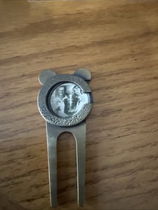 divot tool With Jack Nicholas Picture In It 
