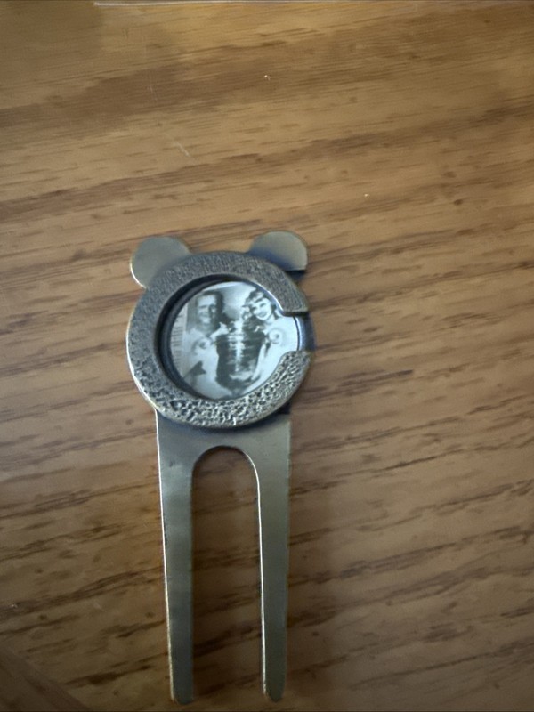 divot tool With Jack Nicholas Picture In It 