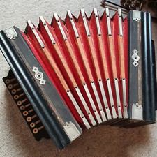 Very old 1 row diatonic button accordion w. 3 couplers at the side