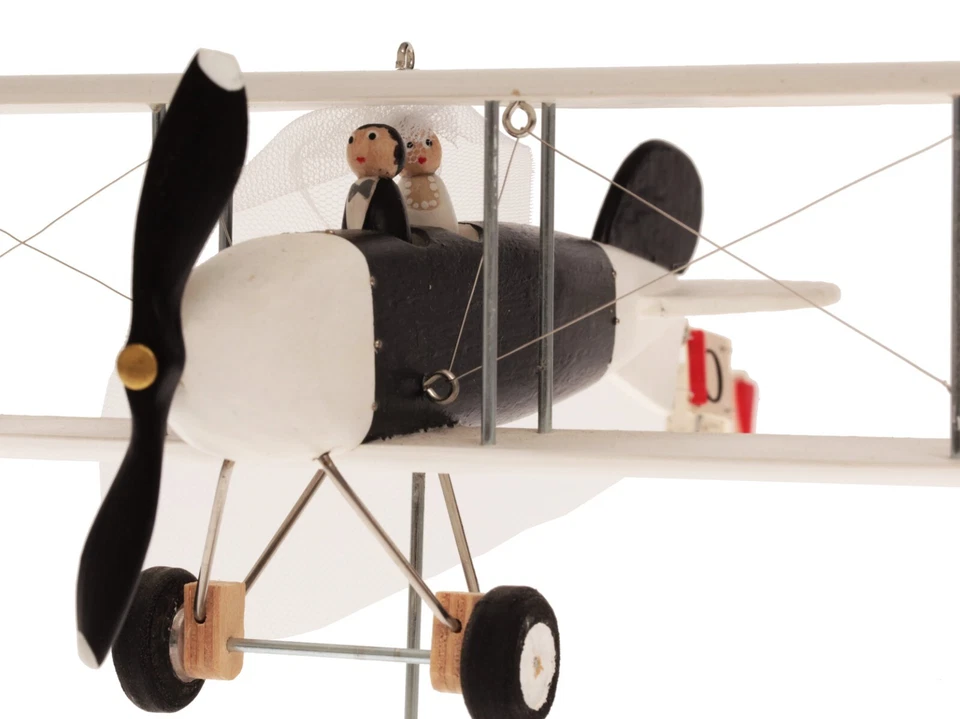 Un avión sobre un soporte, centros de mesa para mesa de boda. Banner personal Foto 3 de 4