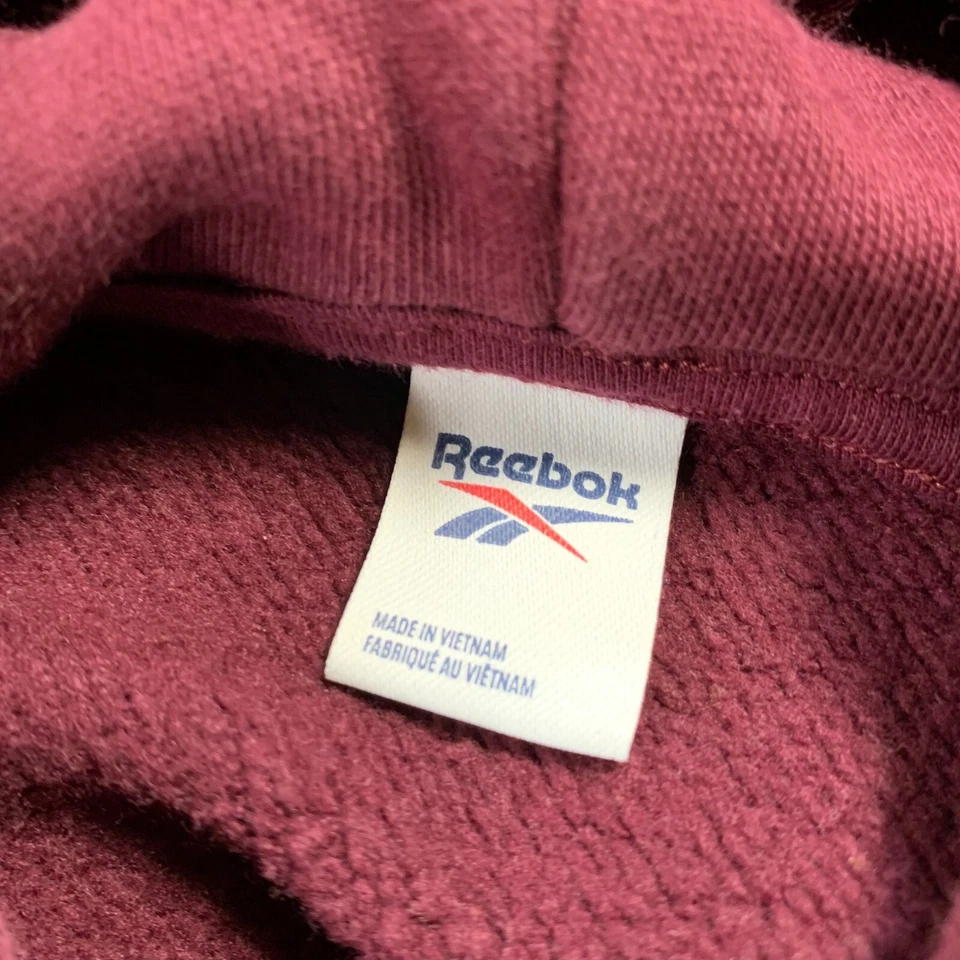 Suéter REEBOK para mujer pequeños bolsillos superiores algodón orgánico Foto 3 de 4