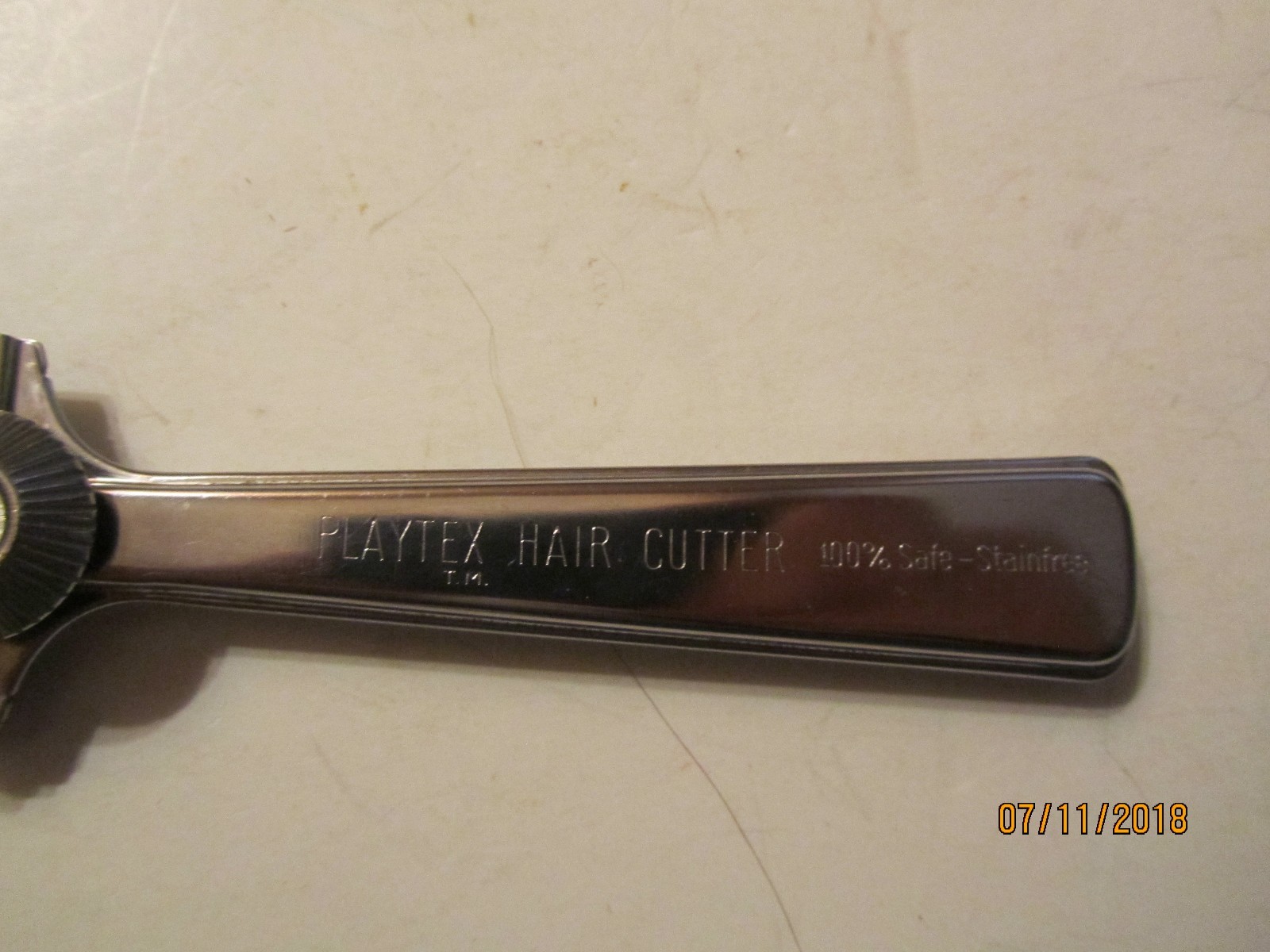 Vintage metal Playtex Hair Cutter with black handle, engraved “100% Safe-Stainfree,” made in U.S.A.