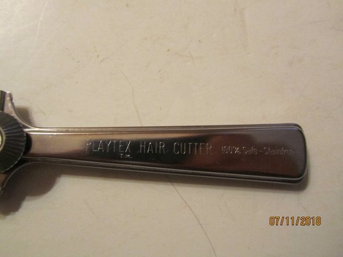 Vintage metal Playtex Hair Cutter with black handle, engraved “100% Safe-Stainfree,” made in U.S.A.