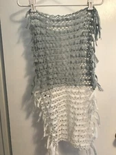 Infinity scarf from Maurice's. Half blue half white with fringe.