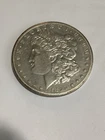 1895-O  Morgan Dollar  possible AU to uncirculated. You judge.