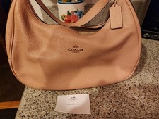 Coach Pebbled Beige Crescent Shoulder Bag with Zipper and Logo Tag