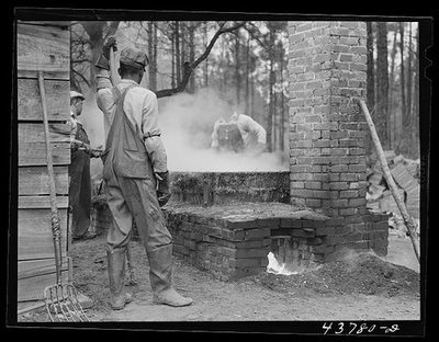 #ad Cleaning turpentine cups in boiling water at a still near Pembroke Georgia $9.99