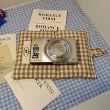 Nikon COOLPIX S7000 Digital Camera 16 MP 20x Optical Zoom with Accessories Gold