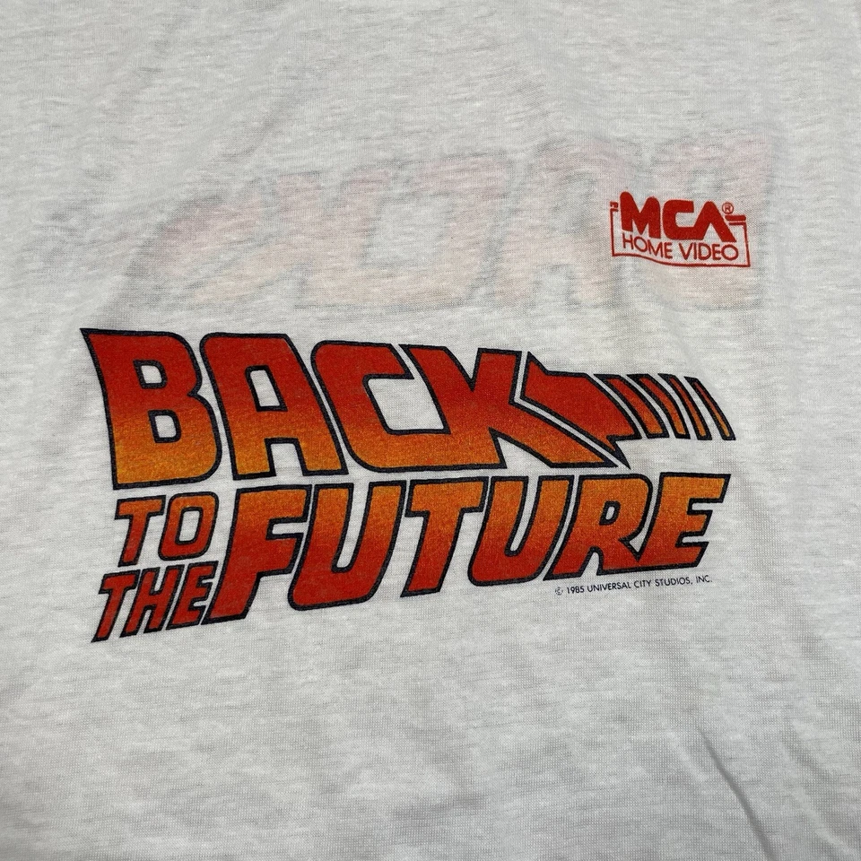Camisa Regreso al Futuro L Años 80 BTTF MCA Hogar Video Lanzamiento de Película Camiseta Promocional Foto 4 de 4