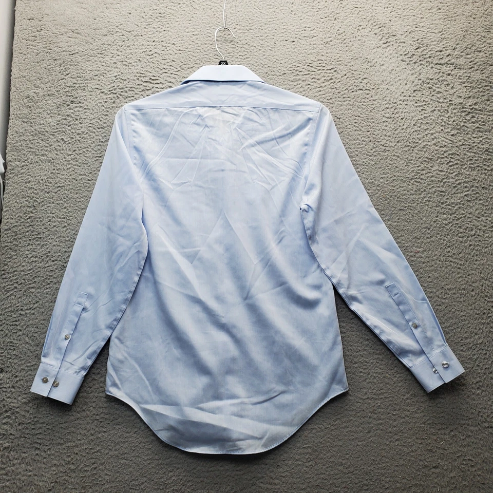 Camisa de vestir Calvin Klein para hombre azul calce ajustado rendimiento cuello sin planchar abotonada Foto 2 de 4