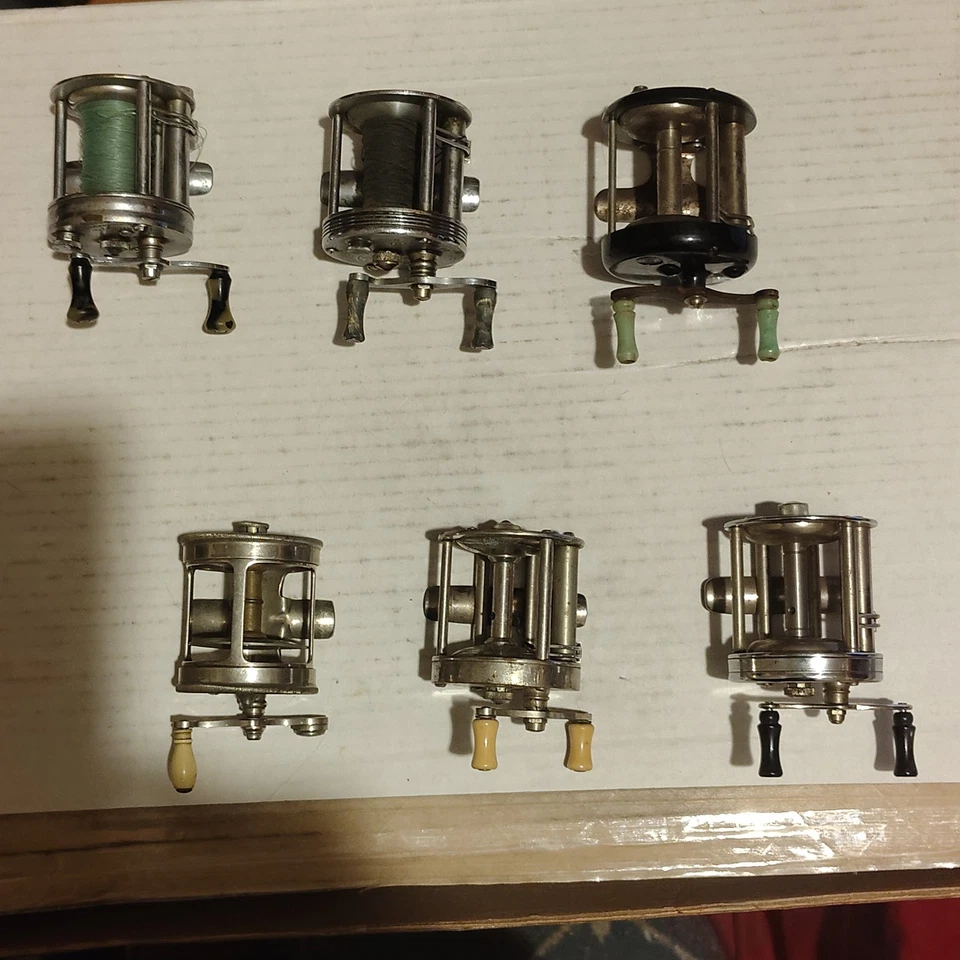 6 carretes de pesca antiguos Shakespeare Belmont Tripart almacenados en caja de madera vintage Foto 3 de 4