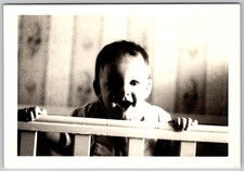 Vtg B&W Snapshot Cute Smiling Baby Holding Crib Railing Nursery Portrait 1940s
