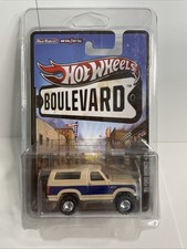 2012 Hot Wheels BOULEVARD '85 FORD BRONCO 4x4 Real Riders (In Protector)