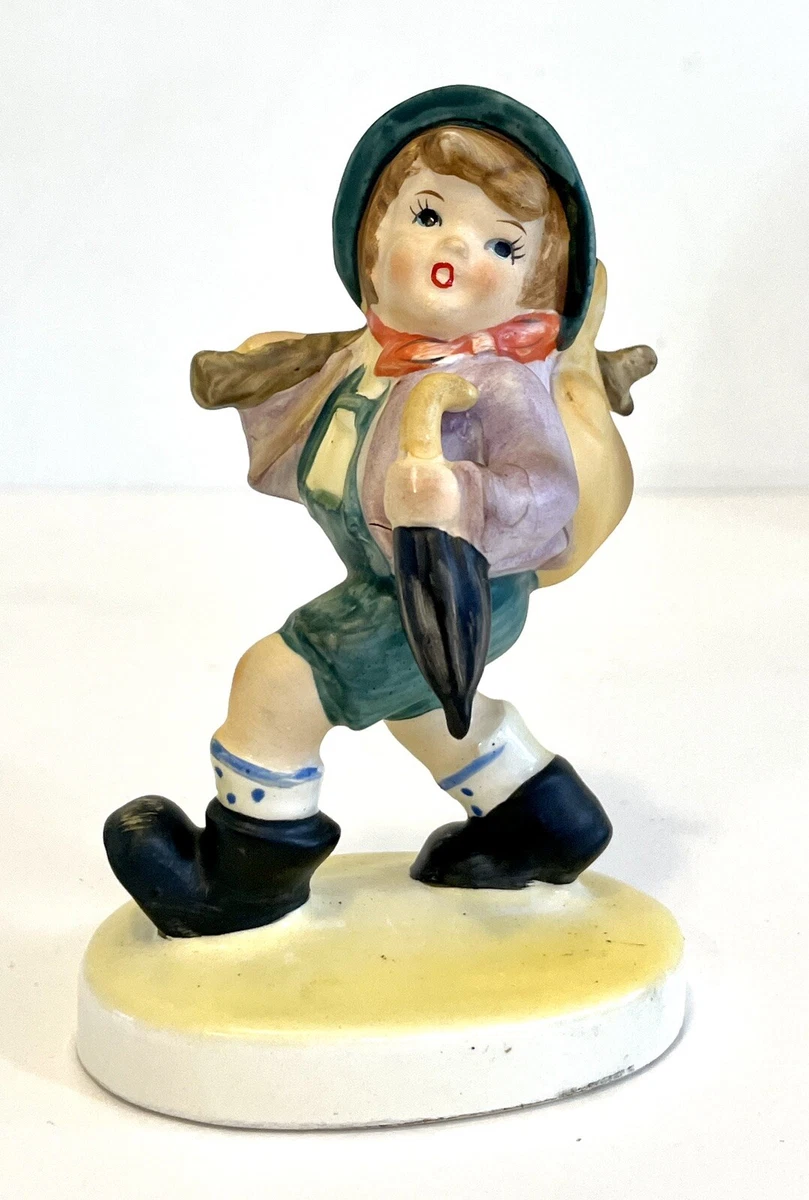 Whistling boy figurine deals
