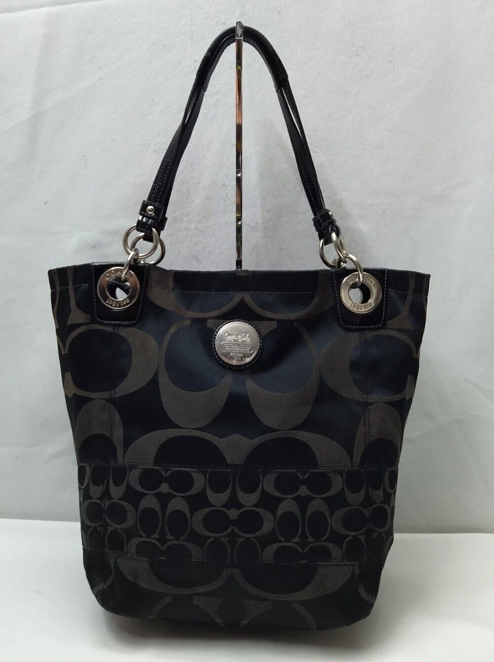 Borsa a tracolla Coach Alex Signature tela nera doppie mani con cerniera secchio tote