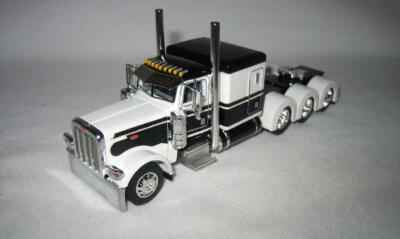 1/64 DCP 102 389 Pete Cab 63  Sleeper Tri-Axle With Cat Engine