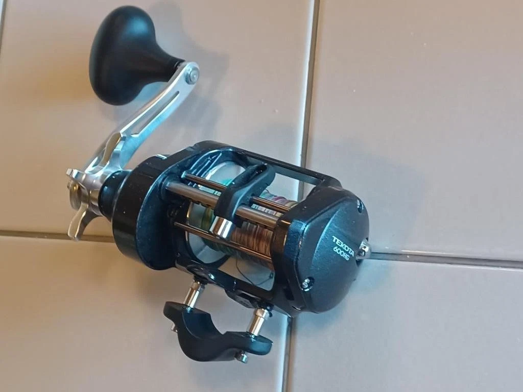 penn 4000 spinning reel combo Wrath II with 7' M 2-Piece Rod Clarus Size:7/8 WT - 275 GR while the EVA grip The @okumafishingusa Drill attachment