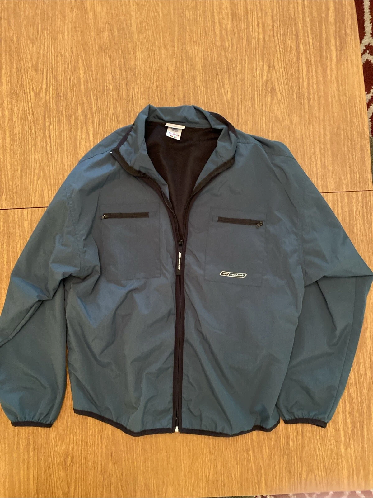 Reebok Unisex Windbreaker Jacket Green Zipper Pockets Mock Neck 100% Nylon Med
