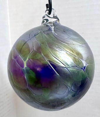 Iridescent Glass Ornament Holiday or Garden Ball. Looks Diffrent in Sunlight!