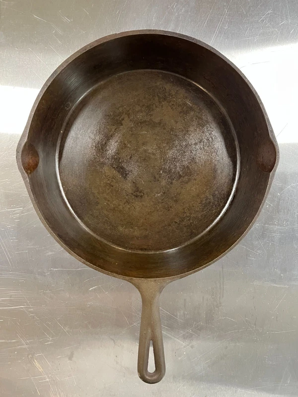vintage Lodge 8-inch cast iron skillet with heat ring and pour spouts