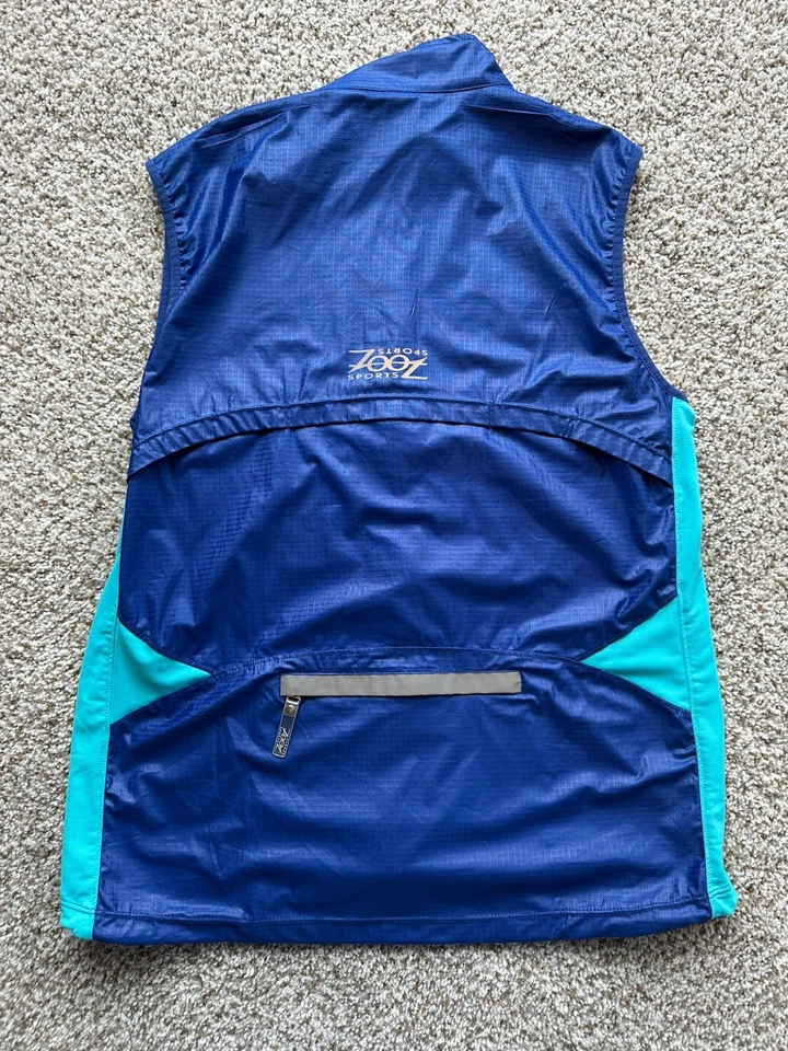 Chaleco deportivo Zoot para correr ciclismo azul para hombre bolsillos grandes cremallera completa reflectante  Foto 3 de 3