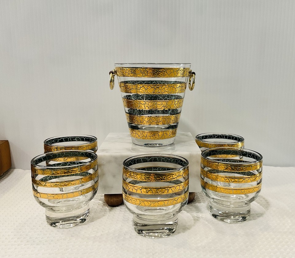 A complete 1960s Culver 'Regiment' 22K gold ice bucket with 5 matching lowball glasses — the gold-dipped barware set that defined mid-century American entertaining.
