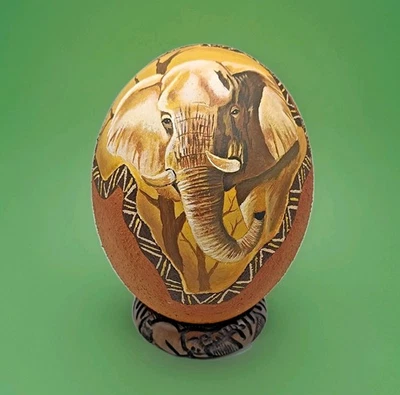 OSTRICH EGG TEXTURED FINISH & CARVED WOODEN STAND. ELEPHANT DESIGN. PAINTED. - Image 1 of 4