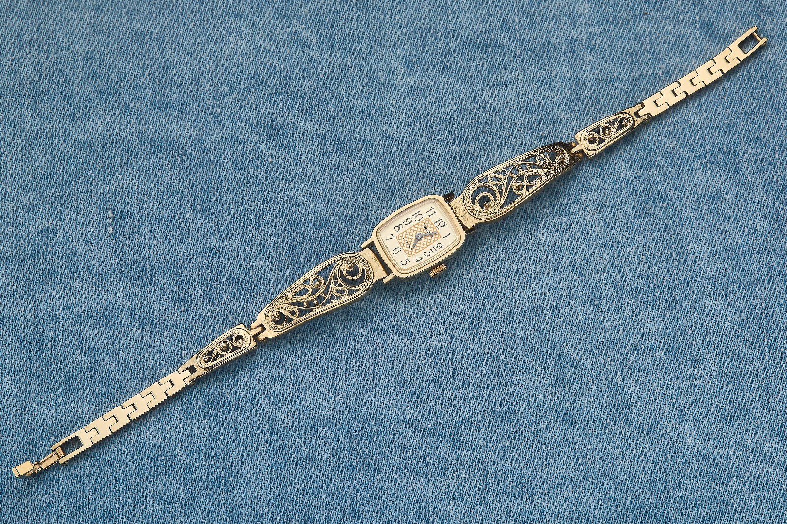 Small women's cocktail watch with gold color. Vintage women's mechanical watch.