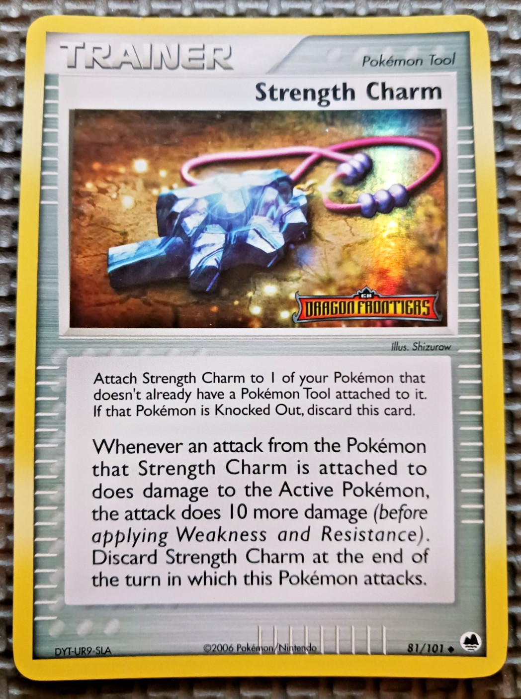 2006 Pokemon Dragon Frontiers #81 Strength Charm Reverse Holo LP