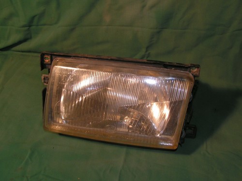 (D4) VW Polo Hella Scheinwerfer links mit Stellmotor VW 867941005A original