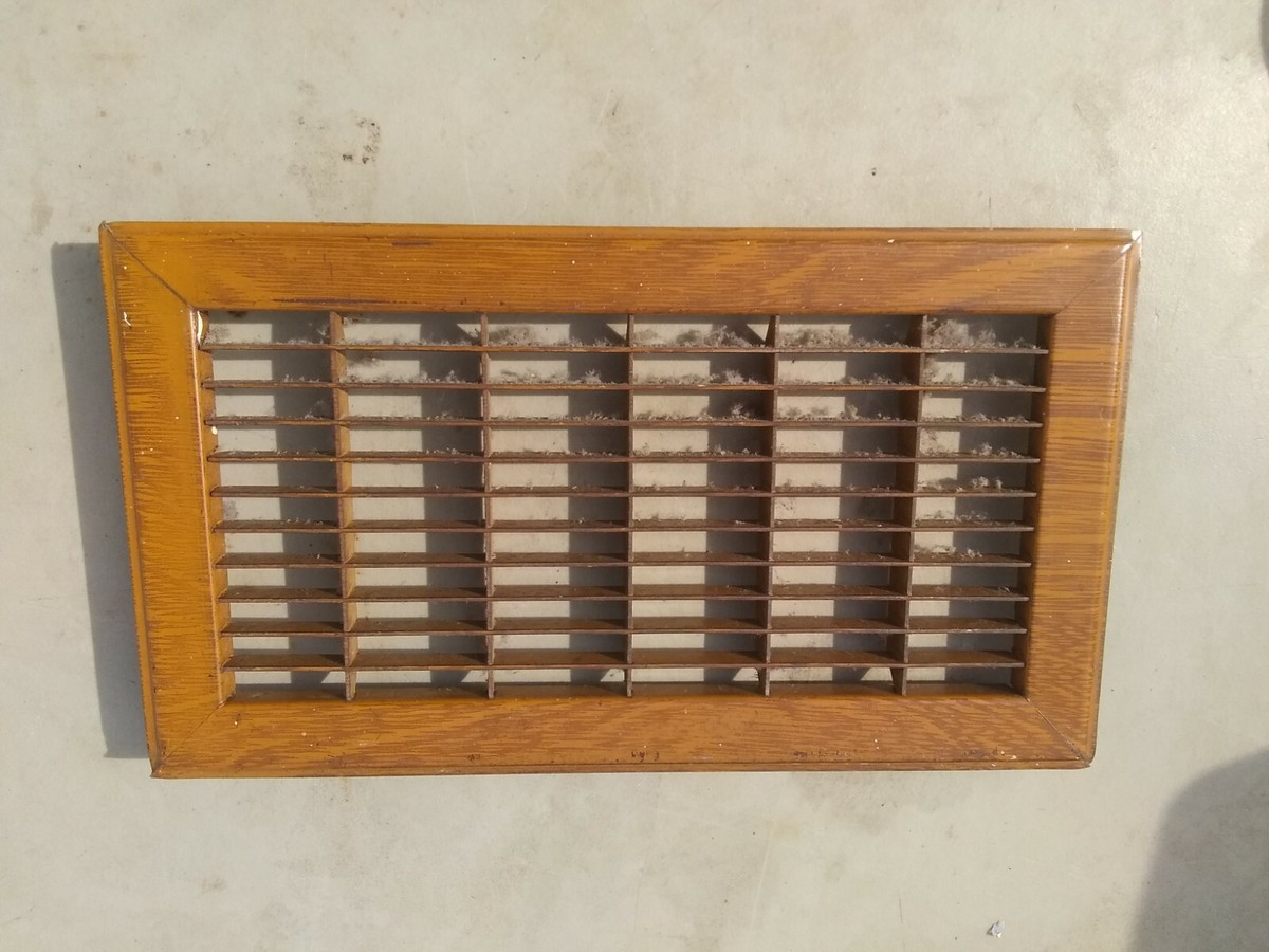 Vintage metal floor furnace register vent grate cover for opening