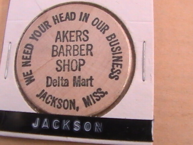 WOODEN NICKEL AKERS BARBER SHOP DELTA MART JACKSON MISS YOUR HEAD IN OUR BUSINES