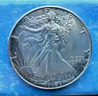 1986 American silver eagle first year of issue uncirculated.