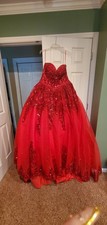 Red ball gown by Nina Canacci.