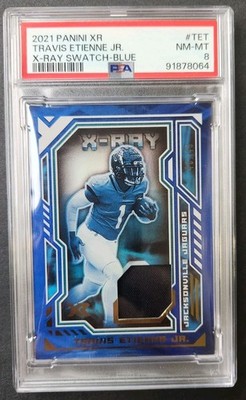 2021 Panini XR Travis Etienne Jr X-ray Swatch Blue RC /49 PSA 8 Jaguars #TET