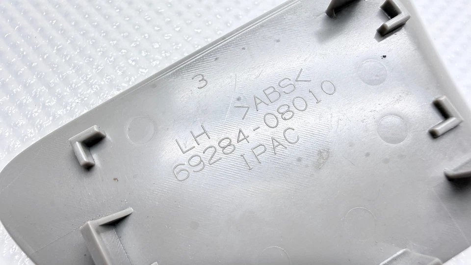 Cubierta de perno de manija interior puerta delantera izquierda Toyota Sienna 2011-2014 69284-08010 OEM Foto 3 de 4