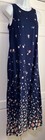 Navy blue sleeveless midi dress with small white floral print, fitted bodice, knee-length skirt, displayed on mannequin.