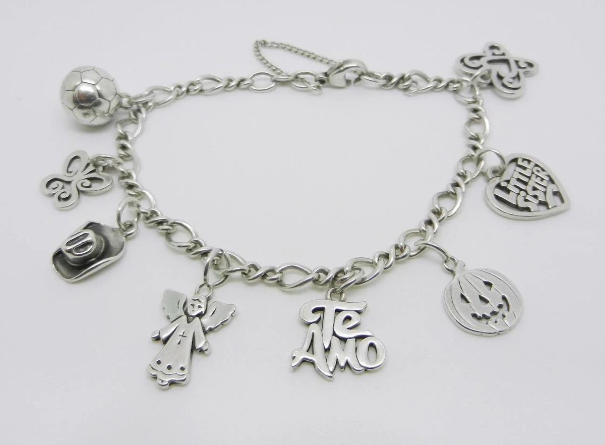 JAMES AVERY STERLING SILVER CHARM BRACELET WITH 8 CHARMS - LB-C1148