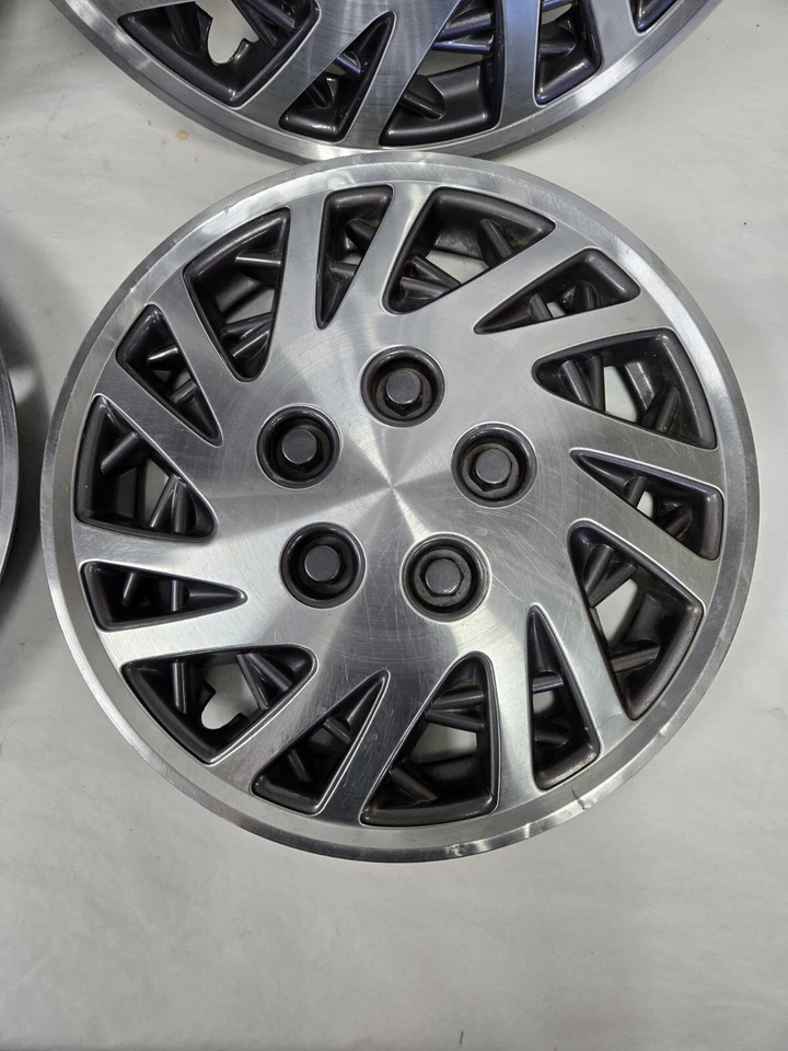 Tapacubos Chrysler Lebaron Dodge Caravan 1993-95 14 pulgadas OEM Mopar Foto 2 de 4