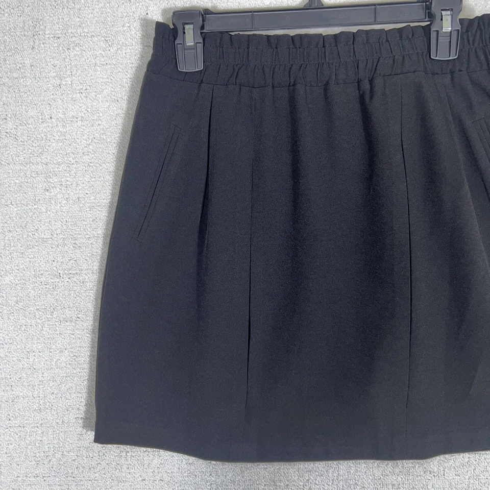 Falda corta plisada Everly negra forrada grande para mujer Foto 2 de 4