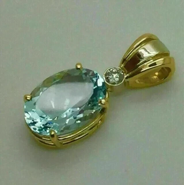 Elegante colgante de aguamarina creado en laboratorio de 2 quilates para mujer acabado en oro amarillo de 14 quilates corte ovalado Foto 4 de 4