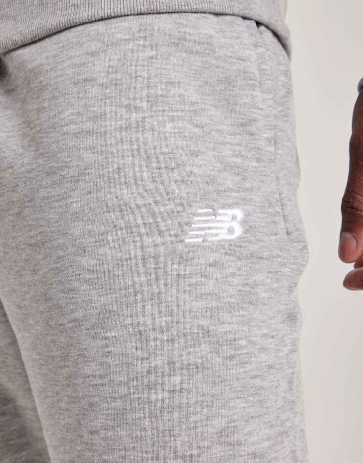 Pantalones de chándal New Balance Sport Essentials de felpa francesa gris atléticos para hombre talla S (O8 Foto 4 de 4