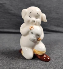 Vintage Unusual Pig Holding Skull Figurine