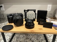 Canon EOS M Mirrorless Digital Camera with Multiple Lens Battery Packs