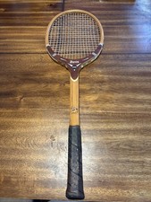 Vintage Davis wooden tennis racquet with compact head and classic black grip. XL