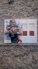 2012 National Treasures NFL Gear Russell Wilson Quad Material 23/25