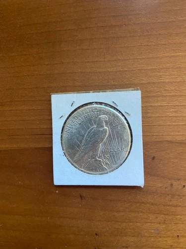 1926 US peace dollar . One ounce of 90% silver . Beautiful uncirculated