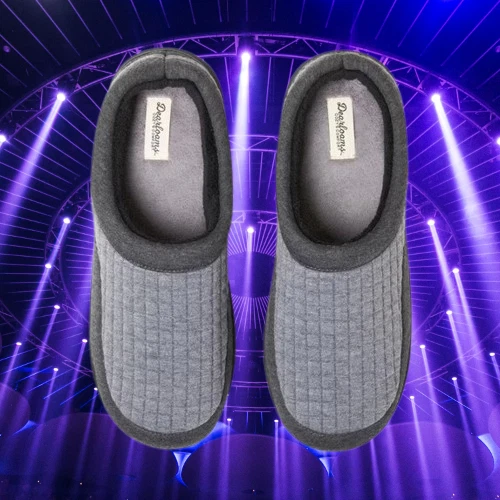 Dark grey Dearfoams men’s lounge clog slippers with textured uppers, size 9-10, on stage with purple lights.