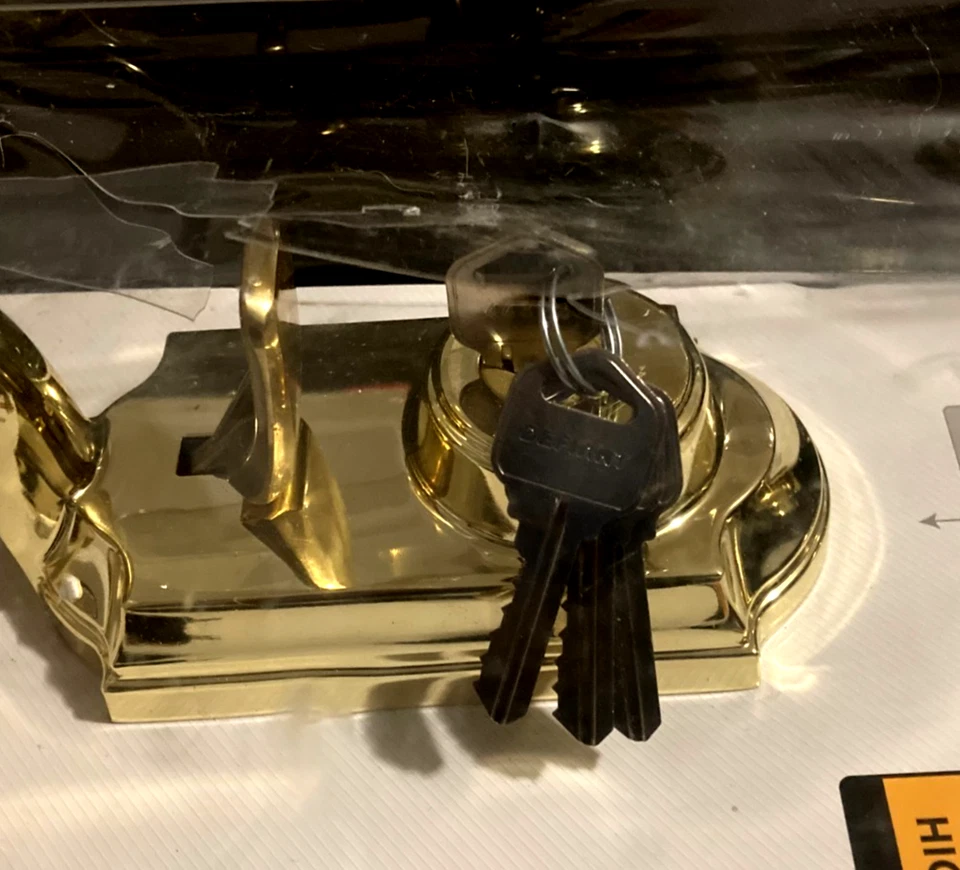 NUOVO set maniglie monocilindriche Kwikset Dakota con pomello porta Tylo - ottone lucido - Immagine 2 di 4