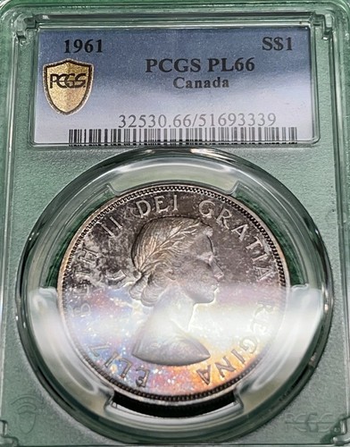 1961 Canada Silver Dollar. PCGS PL66. Rainbow toned. Purple and pink hues.